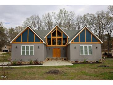 Modern home with gray siding and unique design at 1203 Keith Hills Rd, Lillington, NC 27546
