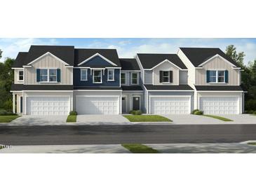 Four townhomes with attached garages and neutral siding at 136 Malbec Dr, Chapel Hill, NC 27516