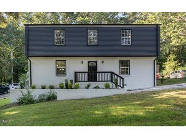 Newly renovated two story home with black and white exterior at 2113 Eveton Ln, Sanford, NC 27330