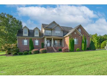 Brick house exterior with lush lawn and landscaping at 3105 W Hampton Dr, Rocky Mount, NC 27804