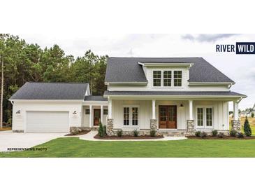 Charming farmhouse-style home with a large front porch at 198 Farmstead Ct, Wendell, NC 27591