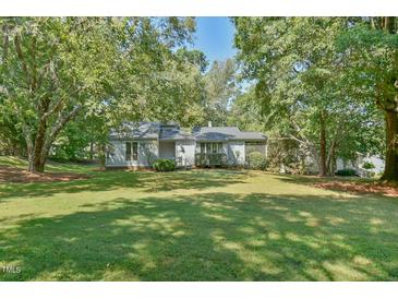 Single-story house with a large front yard at 185 Weatherbend, Pittsboro, NC 27312