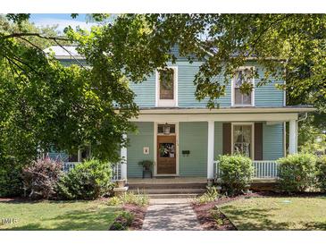 Two-story home with porch and landscaping at 214 College St, Oxford, NC 27565