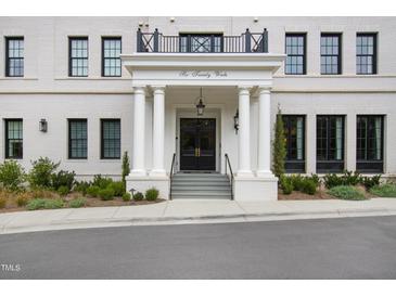 Six Twenty Wade building entrance with columns, double doors, and landscaping at 620 Wade Ave # 301, Raleigh, NC 27605
