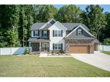 Two-story home with stone and shingle exterior at 159 Shady Oaks Dr, Benson, NC 27504