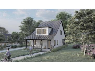 Modern farmhouse exterior with metal roof and covered porch at 109 Jones Ave, Hillsborough, NC 27278