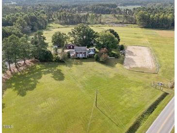 Aerial view of house on large lot with riding arena at 8428 Nc 39 Highway, Middlesex, NC 27557