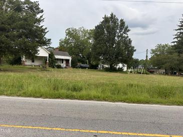 Aerial view of property with two houses and a large yard at 4516 Us 301, Four Oaks, NC 27524