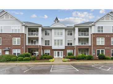 Brick building exterior with parking and landscaping at 215 Eyam Hall Ln, Apex, NC 27502