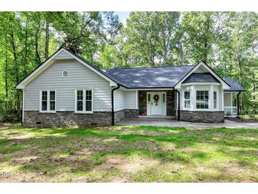 Charming one-story home with stone accents at 116 Oak Ridge Dr, Willow Springs, NC 27592