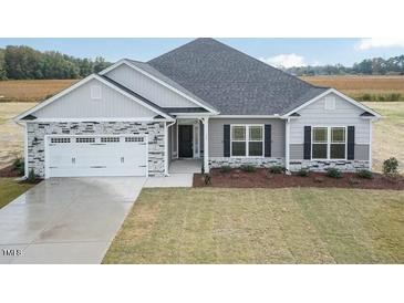 Two-story home with stone and siding exterior at 1491 Pecan Dr # Model Home, Nashville, NC 27856