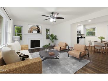 Bright living room features a fireplace and plenty of natural light at 1006 Linwood Ave, Durham, NC 27701