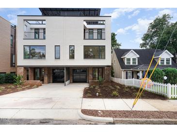 Modern two-unit building with sleek design and double garages at 515 W Lenoir St # 102, Raleigh, NC 27601
