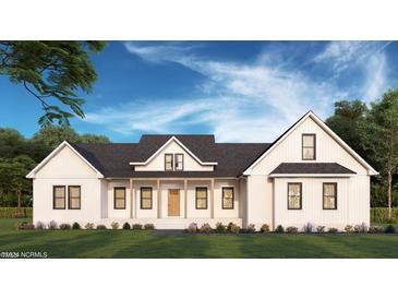 Stunning farmhouse exterior with a covered porch at Tbd 1 Cedar Lane Rd, Sanford, NC 27332