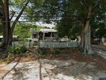 Cute ranch home with brick facade and two car garage at 18 S Hillsborough St, Franklinton, NC 27525