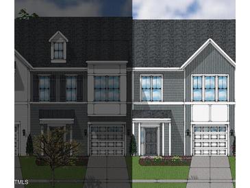 Modern two-story townhome with gray siding and two-car garage at 27 Pansy Park # 230, Clayton, NC 27520