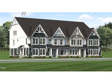 Three-unit townhome building with modern farmhouse exterior, featuring gray and white siding at 3024 White Rail Dr, Fuquay Varina, NC 27526