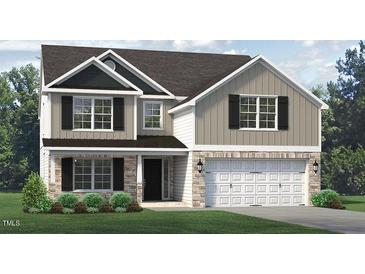 Two-story house with stone and neutral siding, two-car garage at 1929 Darrell Dr # 7, Graham, NC 27253