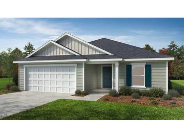 New construction home with gray siding, white garage door and teal shutters at 77 Frasier Fir Way, Lillington, NC 27546