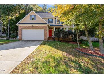 Brick home with two-car garage and landscaped yard at 65 Applegate Dr, Franklinton, NC 27525
