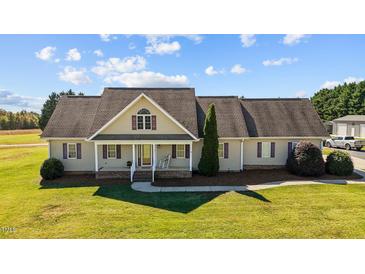 Ranch style home with a large yard and attached garage at 600 Boone Rd, Burlington, NC 27217