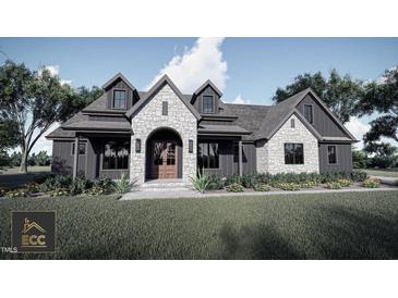 Modern farmhouse exterior with stone accents at Lot 5 Joyful Creek Trl, Zebulon, NC 27597