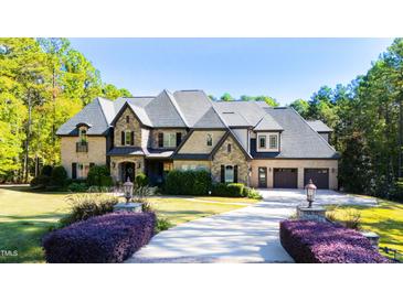 Stunning two-story home with stone accents and large driveway at 2117 Blue Haven Ct, Wake Forest, NC 27587