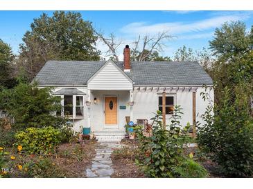 Charming white house with a landscaped front yard and walkway at 113 Higbee St, Durham, NC 27704