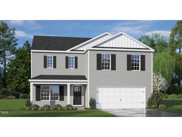 Two-story home with gray siding, white accents, and a two-car garage at 385 Swift Creek Farm Ln, Clayton, NC 27520