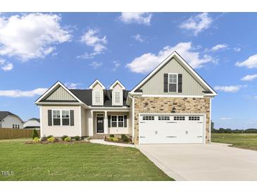 Two-story house with stone and beige siding at 45 S Harper Faith Way, Benson, NC 27504