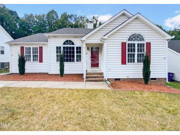One-story house with white siding, red shutters, and landscaping at 6849 Coventry Ridge Rd, Raleigh, NC 27616