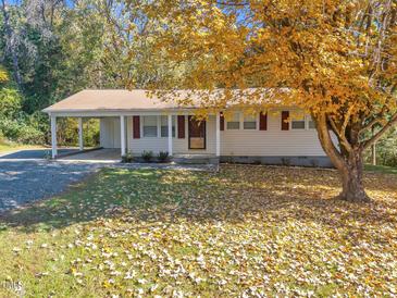 Ranch home with carport and mature trees at 112 Bradsher Rd, Roxboro, NC 27574
