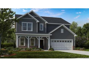 Two-story home with gray siding, white trim, and a two-car garage at 2620 Stonington Dr, Cary, NC 27523