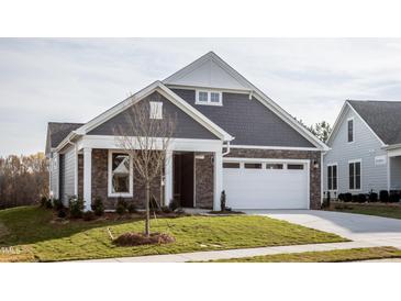 Gray-toned two-story house with white garage door and landscaped lawn at 1230 Linkwood, Homesite 44, Fuquay Varina, NC 27526
