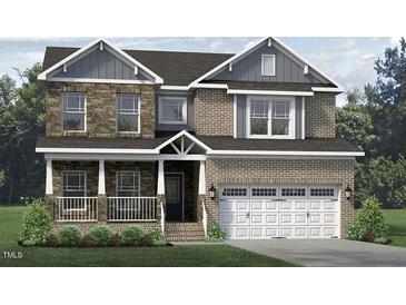 Two-story brick home with large windows and a three car garage at 1064 Tulloch Ct # 212, Burlington, NC 27215