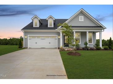 Gray two-story house with a two car garage and front porch at 53 Macy Cir, Wendell, NC 27591