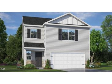 Two-story house with gray siding, white trim, and a two-car garage at 210 Bay Laurel Dr, Sanford, NC 27332
