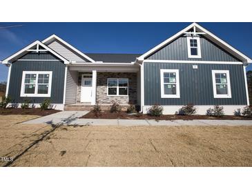 Two-story house with gray and dark blue siding at 671 Howards Crossing Dr, Wendell, NC 27591