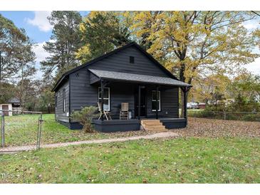 Dark gray house with a covered porch and landscaping at 617 Orange Heights Loop Rd, Hillsborough, NC 27278