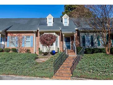 Brick townhouse exterior with steps and landscaping at 1242 Shadowbark Ct, Raleigh, NC 27603