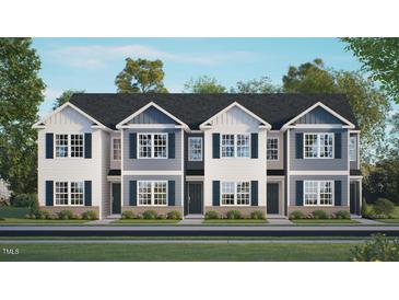 Three-unit townhome building with gray and white siding at 131 Holmes Corner Dr, Smithfield, NC 27577