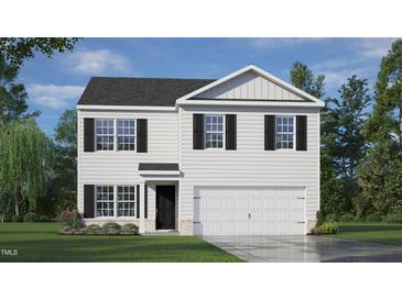 Two-story home with white siding, black shutters, and a two-car garage at 241 Holton St, Smithfield, NC 27577