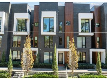 Modern townhome with wood and brick exterior at 222 Saint Marys St, Raleigh, NC 27605