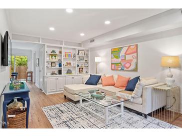 Spacious living room with built-in shelving and comfortable seating at 3738 Yorktown Pl, Raleigh, NC 27609