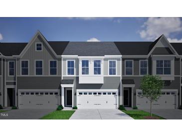 New townhome community with inviting curb appeal and attached garages at 190 Nimble Way # 218, Clayton, NC 27520