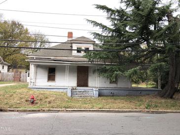 White house with front porch needs renovation at 313 E Umstead St, Durham, NC 27707