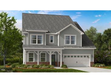 Two story gray house with white accents at 908 Delano Dr, Knightdale, NC 27545