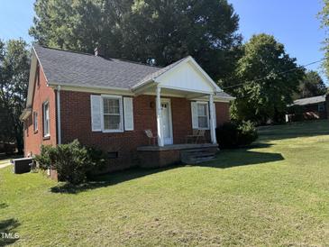 Brick ranch house with a covered porch at 2222 Sunset Hills Dr, Burlington, NC 27215