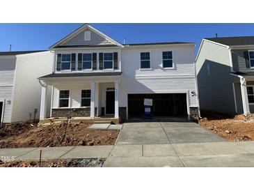 Two-story home with gray siding, white trim, and a two-car garage at 3713 Watson Ridge Ln # Tessa, Raleigh, NC 27616