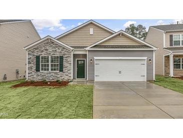 Craftsman style home with stone accents and a two-car garage at 425 Ashley Run, Sanford, NC 27330